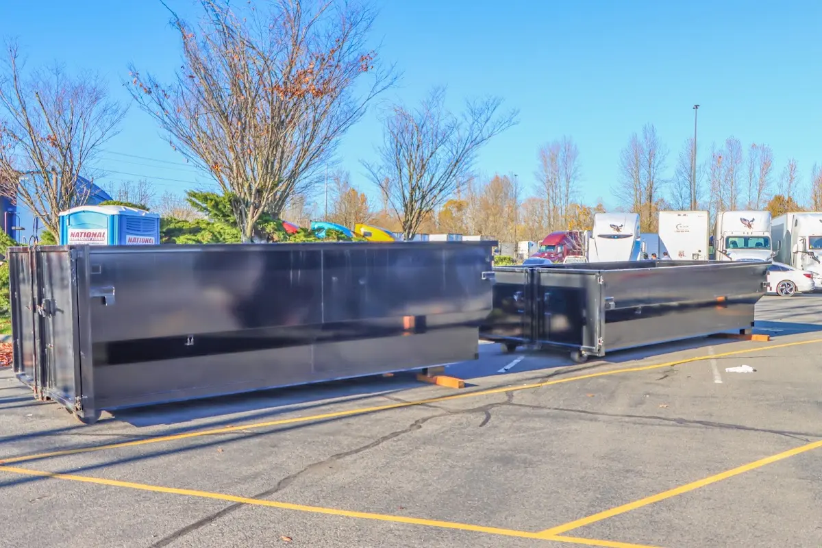 Professional dumpster rental service with roll-off container on residential driveway in Gettysburg